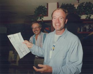 Here it is: SkyDome president Chuck Magwood celebrates last night at a downtown restaurant across from the site with a copy of the stadium's occupancy permit which was hard won from the city