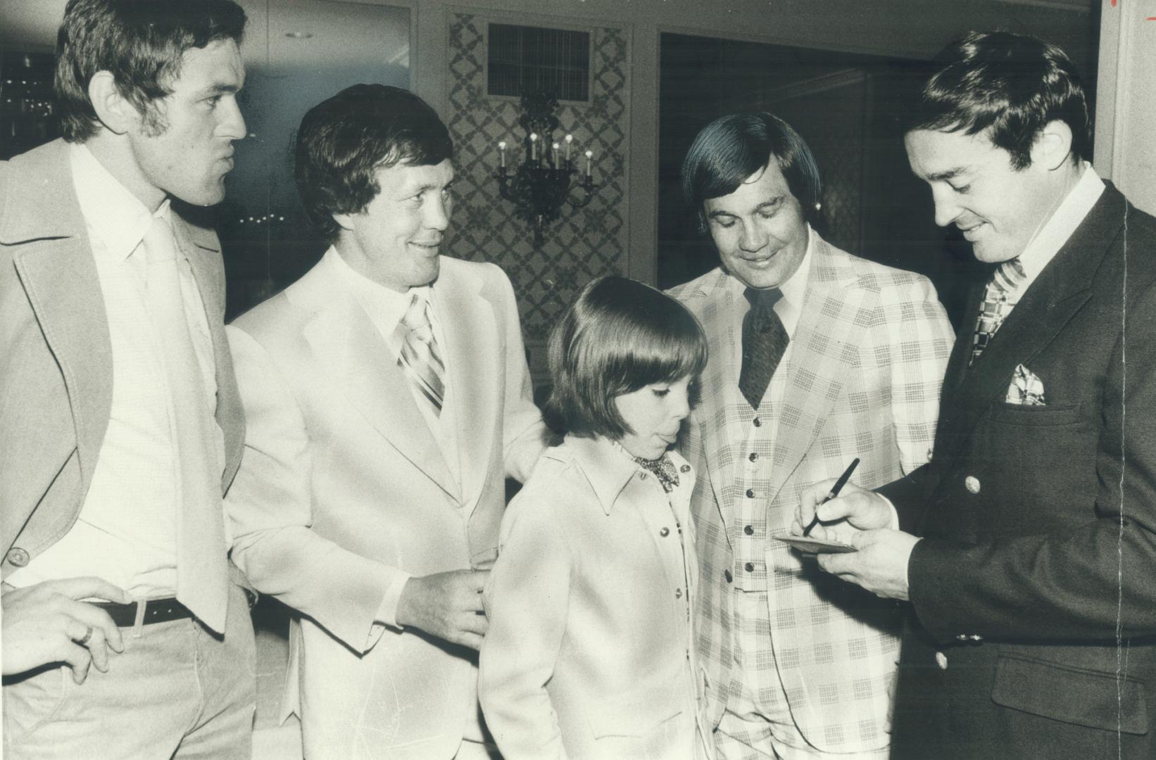 Meeting the stars: Young Chuck Fletcher collects an autograph from Toronto Toros' Frank Mahovlich at last night's Conacher awards dinner at the Royal York Hotel