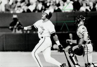 There she goes: Jays outfielder Candy Maldonado and White Sox catcher Ron Karkovice watch as Maldonado's 18th homer sails out of the ballpark in the third inning last night