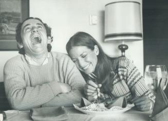 Enjoying a hearty meal of escargots, French movie director Louis Malle and Montreal-born actress Alexandra Stewart chatted with Star staff writer Frank Rasky during visit to Toronto to publicize his movie, Black Moon