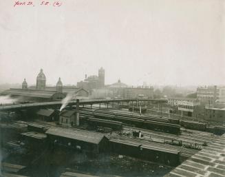 Image shows a bridge over some buildings.