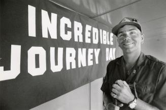 Simply incredible: Ken McColm flashes a beaming smile at Nathan Phillips Square yesterday, after the blind walker arrived in Toronto on his coast-to-coast trek to raise money for diabetes research