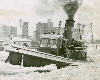 Boat encased in ice at Midland Harbor, Ont.