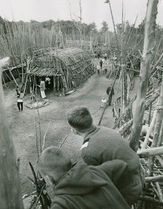 Visitors observing historic Sainte-Marie Among the Hurons in Midland, Ont.