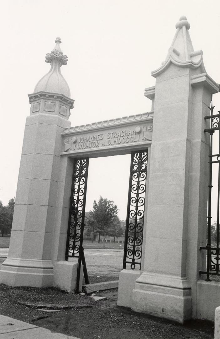 Trinity College (1852-1925) gates, Queen Street West, north side, at Trinity Drive, between Gore Vale Avenue and Crawford Street, Toronto, Ontario.