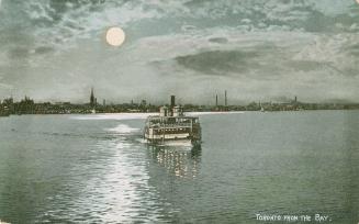 Image shows a ferry on the lake at night in the moonlight with some Harbour buildings in the ba…