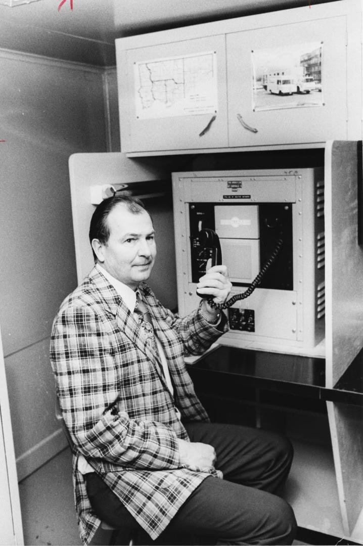 Controller Robert Yuill checks out police radio in bomb proof room at the Aurora Rediness Centre. Aurora, Ontario