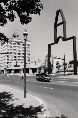 New city hall (left) and old city hall Monument,  from Collier Street. Barrie, Ontario