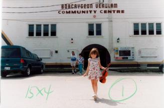 Savannah Dares, 4, in front of the Bobcaygeon Verulam Community Centre, Kawartha Lakes Ontario Open Fiddle and Step Dance Contest. Bobcaygeon, Ontario