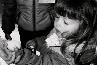 Linsey Gillingham from Guardian Day School holds a chicken egg, Donnabrook Farm Interpretive Centre. Bolton, Ontario