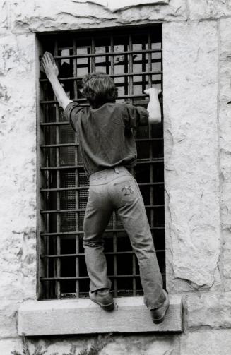 Mimico Correctional Centre inmate sanding bars at Brampton Jail. Brampton, Ontario