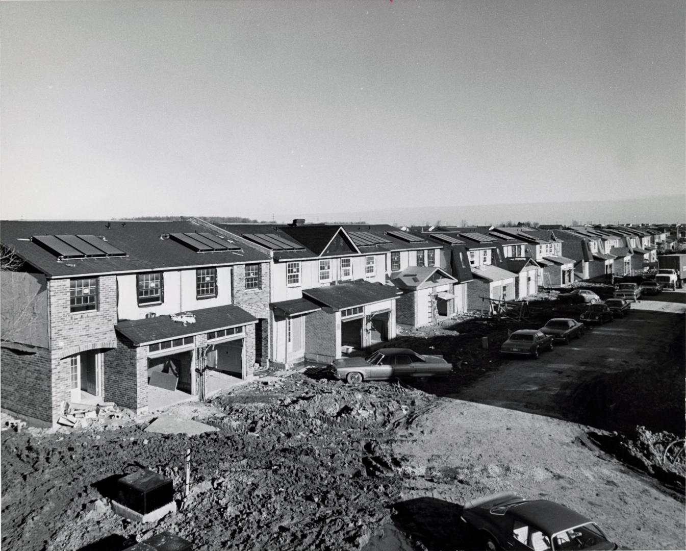 Townhouses with solar panels under construction, off Dixie Road north of Highway 7. Brampton, Ontario