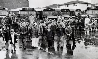 A fleet of 30 purple buses transports 1,700 children to Brampton's Kennedy Road Tabernacle Sunday school. Brampton, Ontario