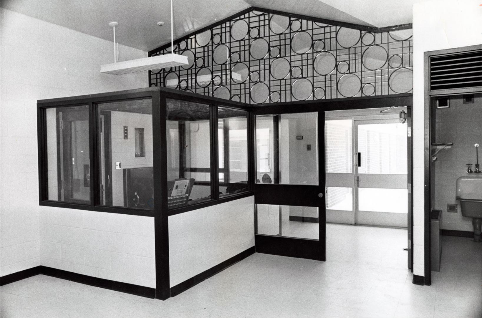 Corrections officers sit in the acrylic-enclosed room at the Vanier Centre for Women. Milton, Ontario