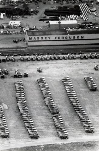 Unsold farm machinery stockpiled at the Massey Ferguson plant. Brantford, Ontario