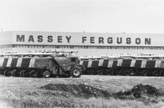 Unsold farm machinery stockpiled at the Massey Ferguson plant. Brantford, Ontario