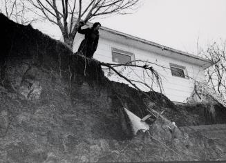 Alwyn Burridge surveys a massive mud slide. Brantford, Ontario