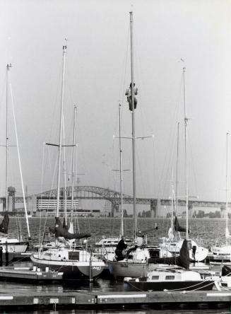 A yachtsman checks the mast of his sailing vessel at the Burlington Boating and Sailing Club. Burlington, Ontario