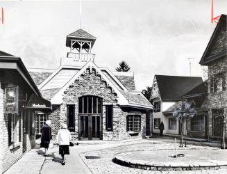 Replica of the old Burlington Town Hall houses four stores in Village Square. Burlington, Ontario