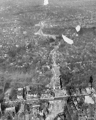 Image shows an aerial view of the road with the bridge over it.