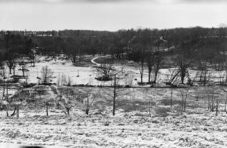 Image shows Don River (West Don River), looking north from foot of Vanderhoof Avenue, Toronto, …