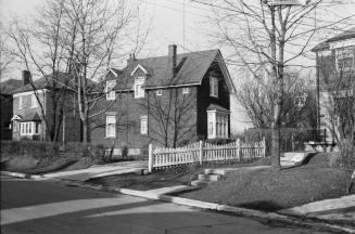 Image shows a few houses along the street.