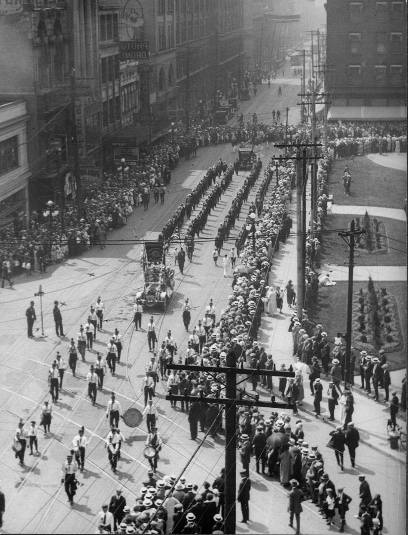 Orange Parade, looking e. along Queen St. West from Bay St