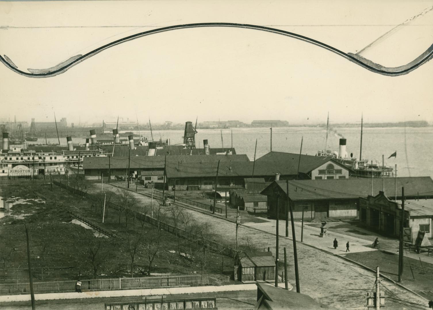 Image shows some buildings by the lake.