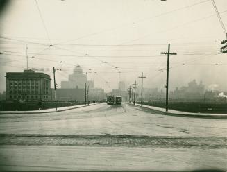 Image shows a street view at the intersection with some multi-floor buildings in the background…