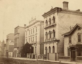 Wellington St. W., south side, looking east to Yonge St.