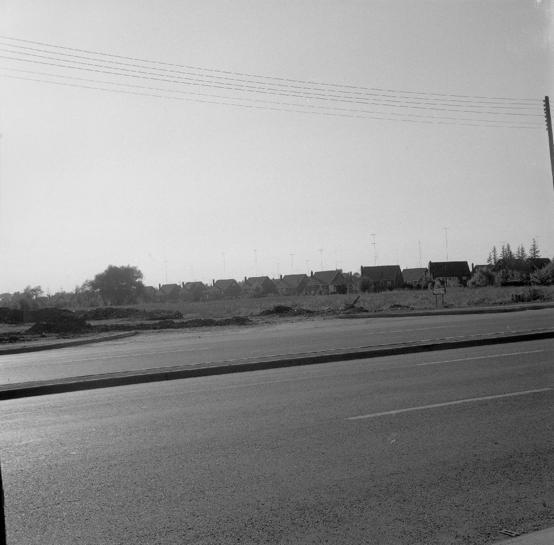 Yonge Street looking northwest at Kempford Boulevard, showing rear of houses on Lorraine Drive in background