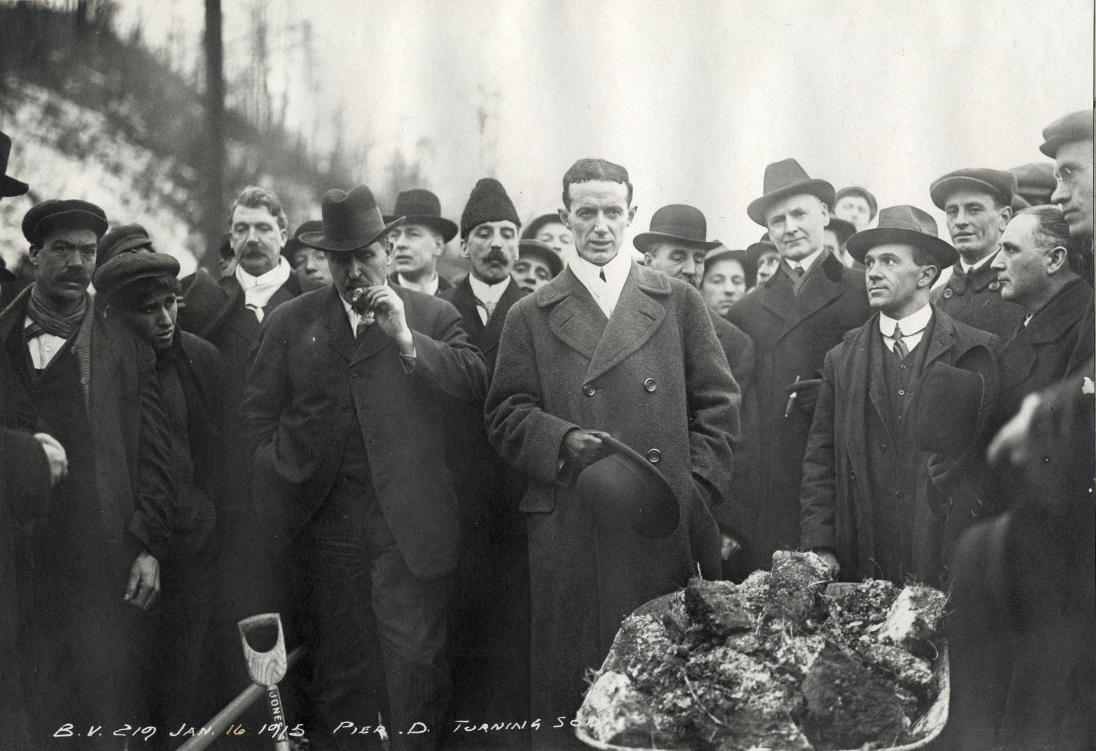 Image shows a group of people gathered for the ceremony.