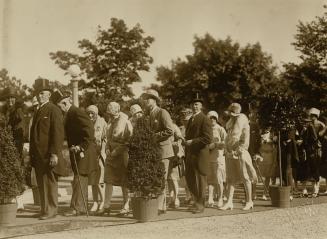 Image shows a group of people outside during the reception.