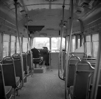  Image shows an interior of a rail car.
