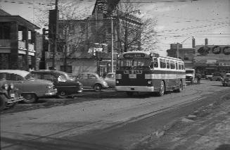 TTC bus #970, on Yonge Boulevard, looking southeast to Yonge Street, Toronto, Ontario. Image sh…