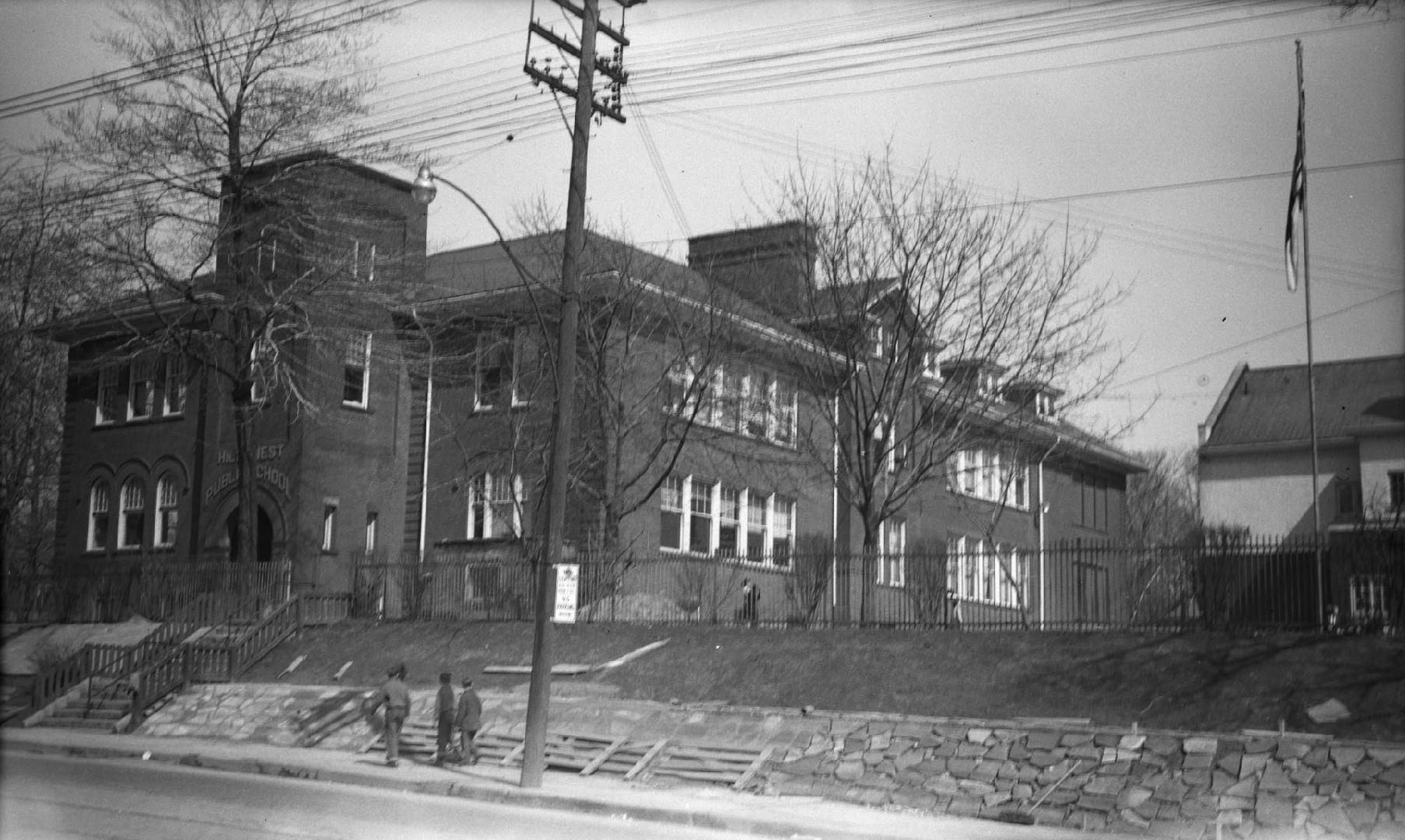 Image shows a partial view of a two storey school building.