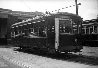  Image shows a few rail cars on the tracks.
