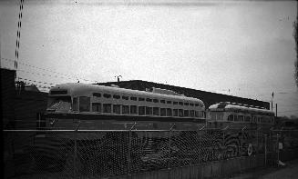  Image shows a few rail cars on the tracks.
