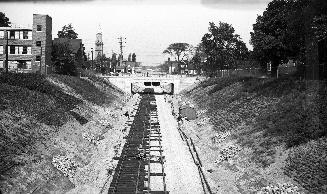 Image shows subway train tracks outside.