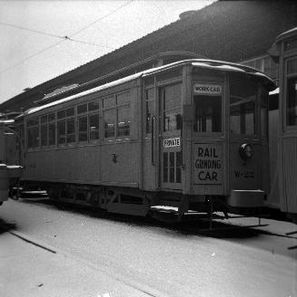 Image shows a work car on the tracks.