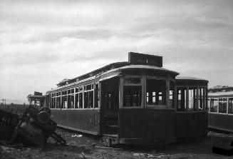 T.T.C., #1804, abandoned on lot on Mill St., showing car #2046 at right