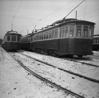 T.T.C., #2098 (at right) at Russell carhouse, Queen Street East, s .w. corner Connaught Avenue