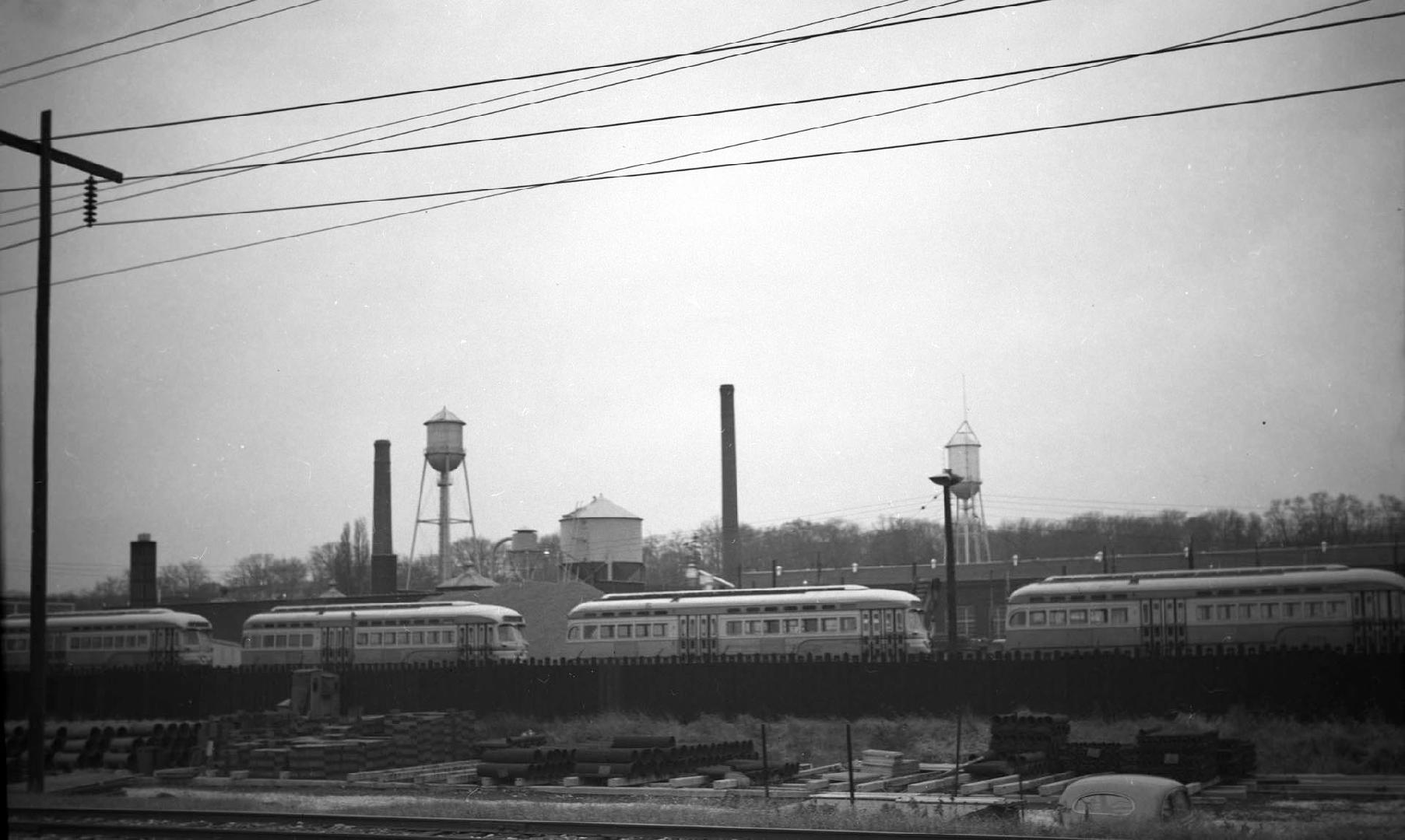 Image shows a few rail cars on the tracks. 