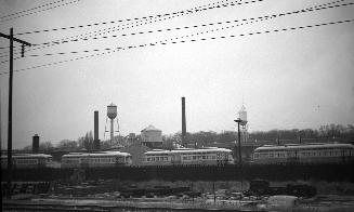 Image shows a few rail cars on the tracks. 