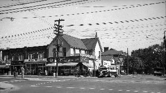 Yonge Street, northeast corner of Davisville Avenue. Image shows a number of stores located at …