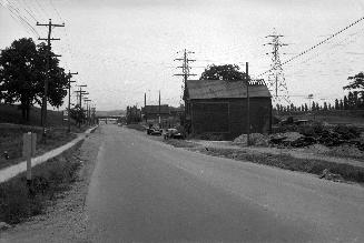 (The) Queensway, looking e. from e. of High St. towards Lakeshore Boulevard W., showing entrance to Humber Valley Golf Club at left