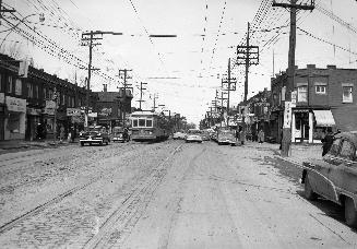 Yonge St. looking north from south of Ranleigh Ave. Image shows Yonge street with a streetcar a…