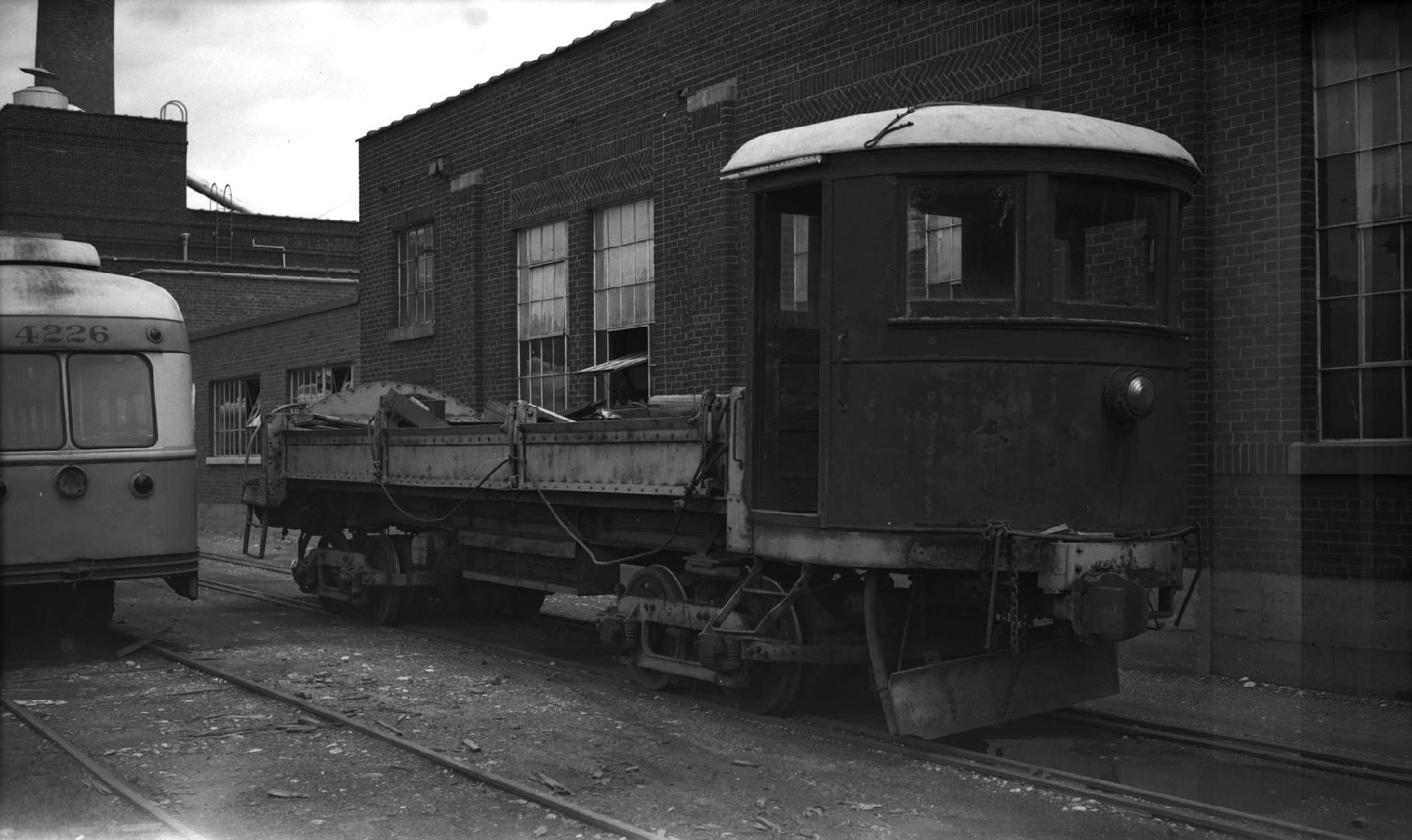 Image shows a work car on the tracks.