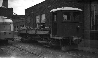 Image shows a work car on the tracks.