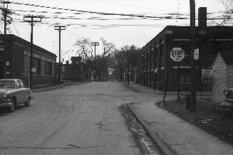 Image shows a street view looking towards the CPR crossing.